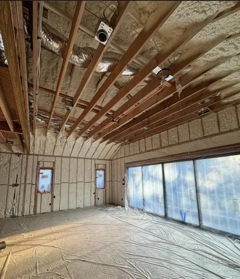 Interior walls and ceiling insulated with spray foam during new construction in Winchester
